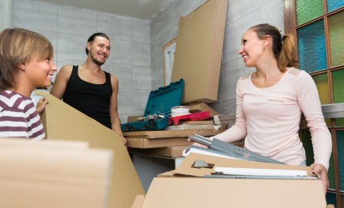 Customer placing items into a secure storage unit at Lewisham Storage