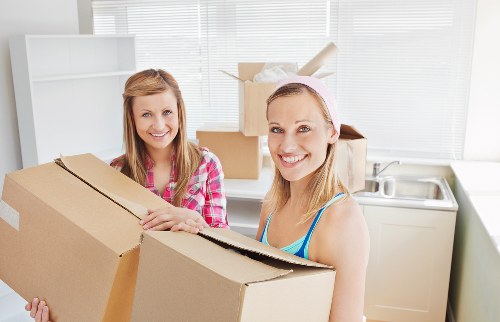 Careful packing of household items by a local removals team in Lewisham
