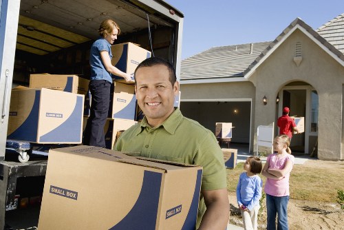 Removal crew handling fragile items during a London move